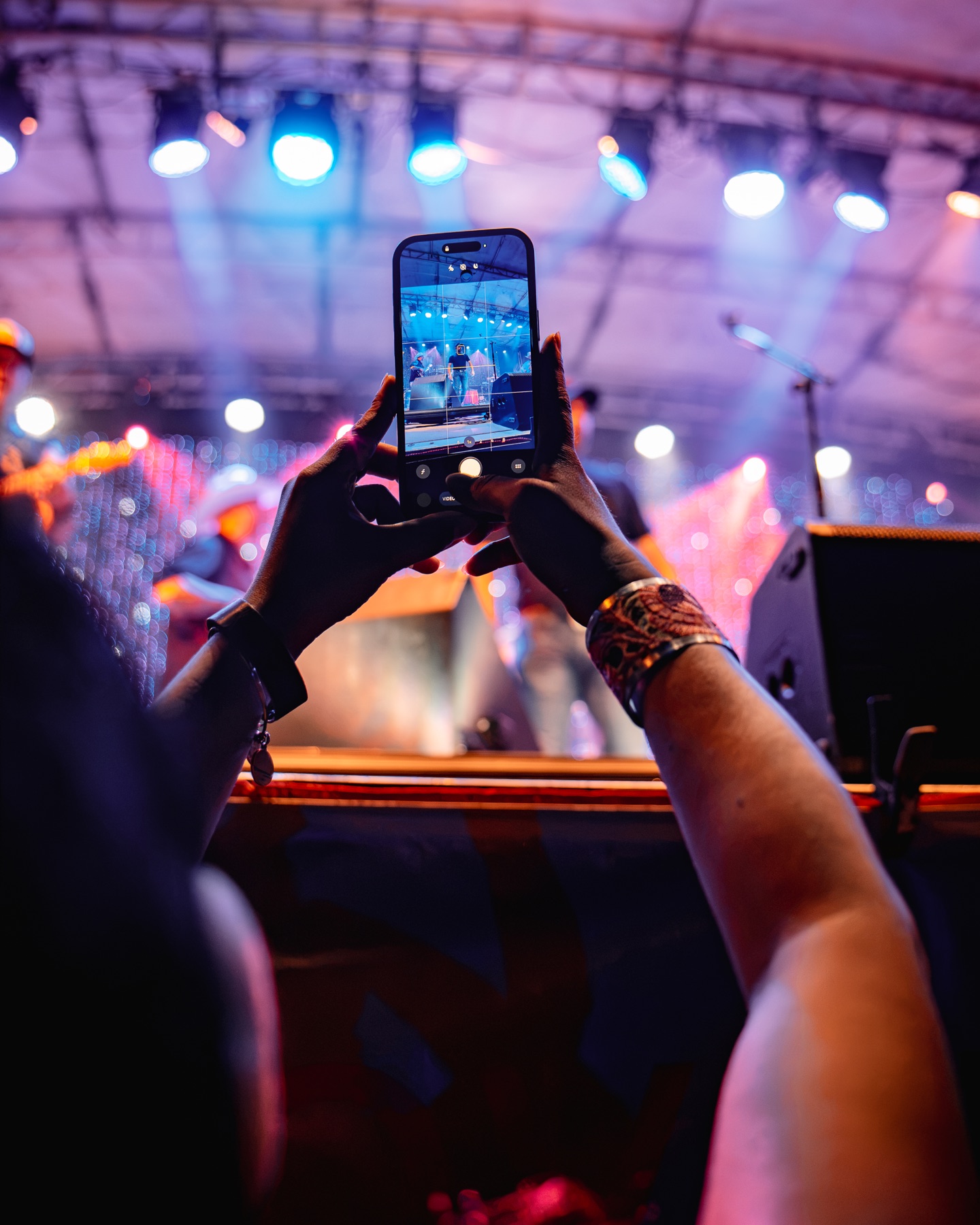A fan filming Tyler Kinch and his band during a live performance